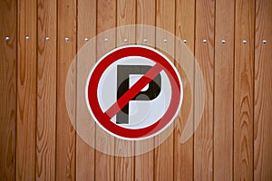 No parking sign on a wooden wall