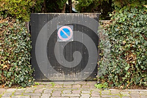 a no parking symbol on a wooden door