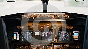 No people in empty airplane cockpit with power buttons