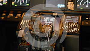 No people in empty aviation cabin with engine lever on dashboard