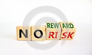 No risk or reward symbol. Turned cubes and changed words `no risk` to `no reward`. Beautiful white background. No risk or rewa