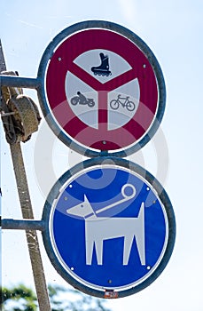 No roller or roller skate sign, no motorcycle sign, no bicycle sign, keep dogs on leads sign.