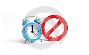 No sign and blue clock on an isolated background. Unavailability at certain hours. Temporary restrictions and prohibitions. photo