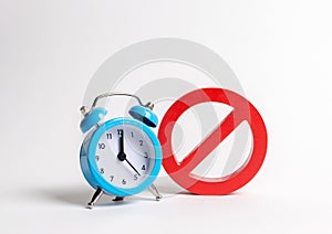 No sign and blue clock on a white background. Unavailability at certain hours. Temporary restrictions and prohibitions