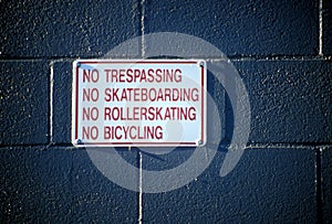 No Sign No Trespassing on a Brick Wall