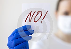 No sign word in doctor hands. Negative answer concept. No risk, no illness, no virus