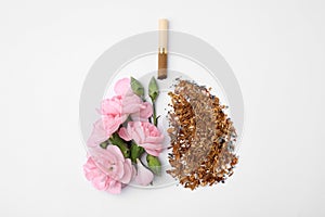 No smoking concept. Lungs made of dry tobacco, cigarettes and pink flowers on white background, flat lay