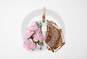 No smoking concept. Lungs made of dry tobacco, cigarettes and pink flowers on white background, flat lay