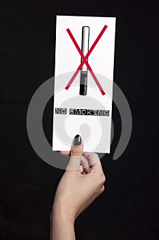 No smoking concept using a hand holding a piece of paper