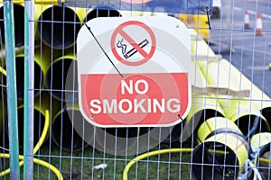No smoking construction safety sign and yellow gas pipe for external works explosion risk