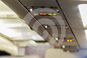 No Smoking and Fasten Seat belt Sign Inside an Airplane. Fasten