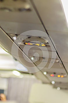 No Smoking and Fasten Seat belt Sign Inside an Airplane. Fasten