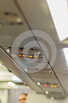 No Smoking and Fasten Seat belt Sign Inside an Airplane. Fasten