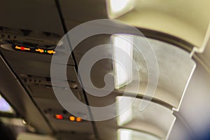 No Smoking and Fasten Seat belt Sign Inside an Airplane. Fasten