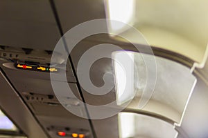 No Smoking and Fasten Seat belt Sign Inside an Airplane. Fasten