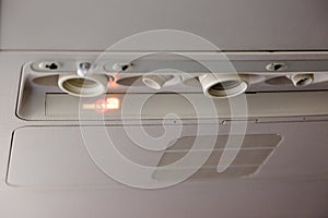 No smoking indicator light information in airplane cabin