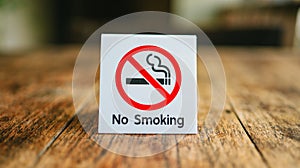 No Smoking label in the public. No smoking sign on wood table at hotel