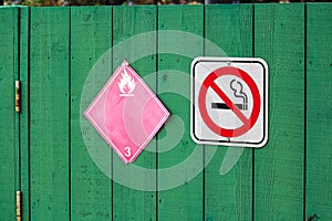 No smoking next to a flammable category 3 hazard sign
