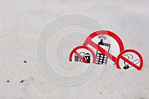No smoking, No photo and No phone calls signs on the beach