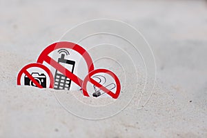 No smoking, No photo and No phone calls signs on the beach