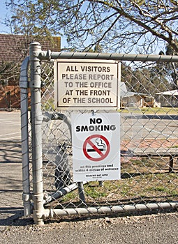 No smoking and other signage at the entrance of a school