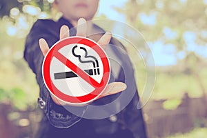 No smoking sign in hand on color background ,health