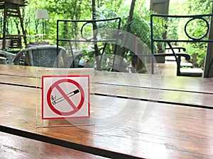 No smoking sign on restaurant table in the garden