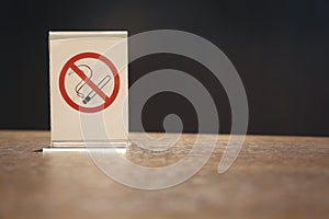 No smoking sign symbol on wooden table