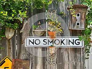 No smoking sign on a wooden fence