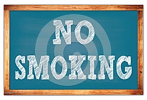 NO SMOKING words on blue wooden frame school blackboard