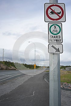 No snowmobile and Shared Pathway sign along 48th street in Yellowknife, Canada