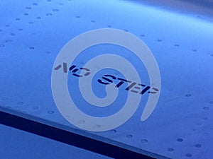 No step letter sign on an airplane wing