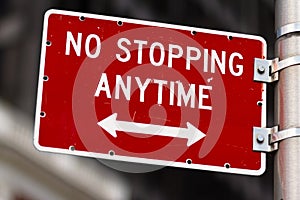 No stopping anytime road sign