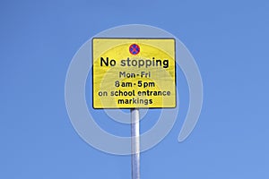 No stopping outside school road safety sign keep clear against blue sky