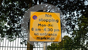 no stopping restriction sign on road street