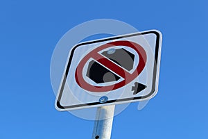 No Stopping Right of Sign Against Blue Sky
