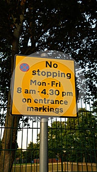 no stopping restriction sign on road street