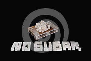 No sugar text written with white refined sugar cubes