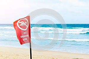 No swimming danger sign at the beach, warning sign at the beach