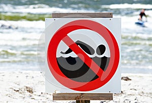 No swimming sign on beach