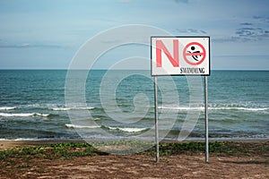 No swimming sign on a beach