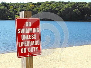 No swimming unless lifeguard on duty beach sign