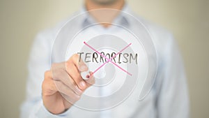 No Terrorism, man writing on transparent screen photo