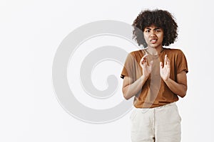 No thanks I refuse. Portrait of displeased intense and unhappy young African American girl with curly hair rejecting