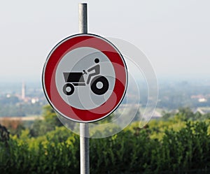 No tractor allowed. Traffic sign. Blurred landscape on background