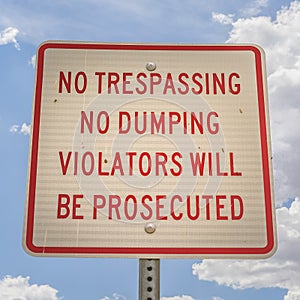 No trespassing and no dumping sign close up