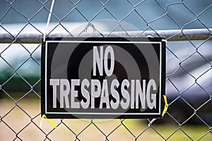 No trespassing sign on a fence.