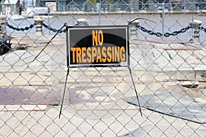 Cleveland, Ohio May 17, 2020 No Trespassing sign posted to link fence to caution no entry, danger.