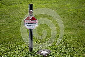 No trespassing sign red white black