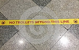 No trolleys beyond this line sign